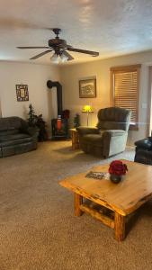 a living room with couches and a coffee table at Davis Beach Getaway Pet Friendly & Beach Access in McCall
