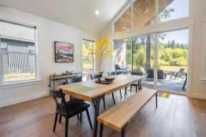 a dining room with a wooden table and chairs at Cabin, Bonus Suite, Suncadia Pool Access in Cle Elum