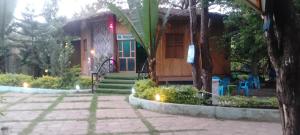 a small house with a porch and a patio at Mathios Hotel & Menafesha in Butajīra