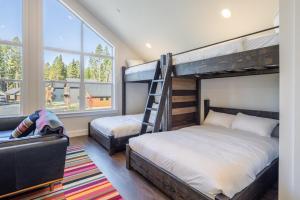 a bedroom with two bunk beds and a ladder at Cabin, Bonus Suite, Suncadia Pool Access in Cle Elum +40 photos