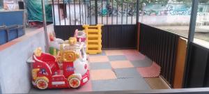 a toy train sitting in a play area at Mathios Hotel & Menafesha in Butajīra