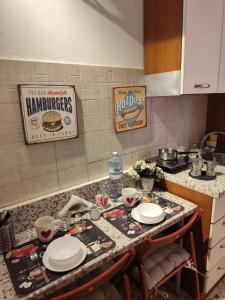 a kitchen with a counter with plates on it at My tiny house in Salerno