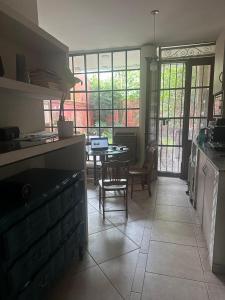 a kitchen and dining room with a table and chairs at Loft Junín in Junín