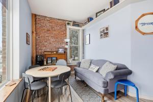 a living room with a couch and a table at The Tiptonian in Tipton