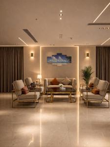 a living room with a couch and chairs and a table at فندق الشهباء الفيحاء Hotel Al Shahba Al Faiha Jeddah in Jeddah