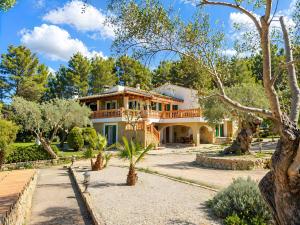 a large house with trees in front of it at Son Grau in Alaró