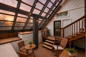 a screened in porch with a skylight and stairs at Cozy Home near Downtown - Close to Nulu - Sleeps 6 in Louisville
