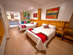 a room with two beds in a room at Sosa Andina House in Huaraz