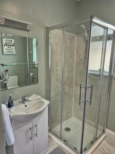 a bathroom with a shower and a sink at Guest Suite in County Limerick in Pallaskenry +40 photos