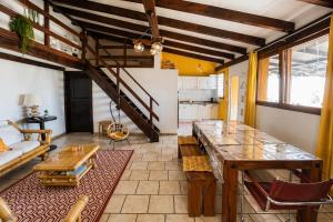 a living room with a table and a couch at Chez Fifi in Surpierre