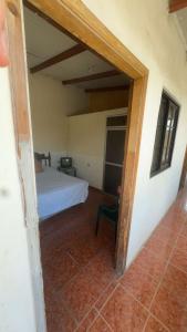 a bedroom with a bed in a room at Accommodation in Copán Ruinas #5 in Copán Ruinas