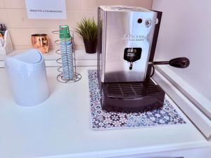 a coffee maker sitting on top of a counter at D ANNUNZIO house in Martinsicuro
