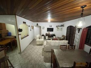 a living room with a couch and a table at Farm km 68 Castelo Branco in Mairinque
