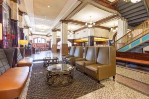 a lobby with leather chairs and tables in a store at Drury Plaza Hotel St Louis Union Station in Saint Louis