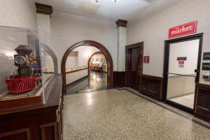 an empty hallway with an archway in a building at Drury Plaza Hotel St Louis Union Station in Saint Louis +45 photos