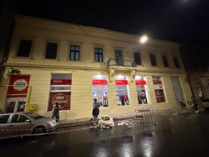 a building with a car parked in front of it at Apartament Centru Wot Diamond in Arad