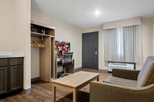 a living room with a couch and a table at Red Roof Inn & Suites Tomah in Tomah