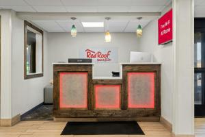 a restaurant with a react root market sign on the wall at Red Roof Inn & Suites Tomah in Tomah +29 photos