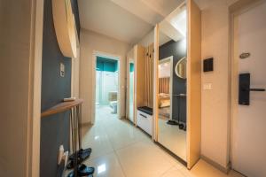 a hallway with a room with a bedroom at Complex Rediu 54 Luxury Apartaments in Iaşi +103 photos