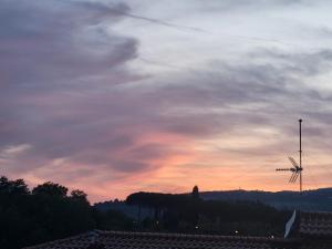 a cloudy sky with a sunset in the background at Civico 16 in Perugia