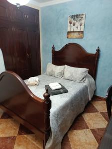 a bedroom with a bed with a tray on it at Villa Stella maison entre Séville et Cadix in Lebrija