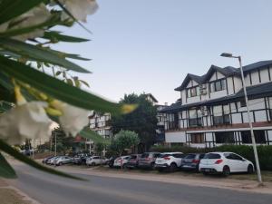 a row of parked cars in front of a building at Villa Ostende Apart Hotel & Spa in Ostende