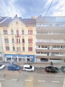 a group of cars parked in front of a building at Beenie 3 in Linz
