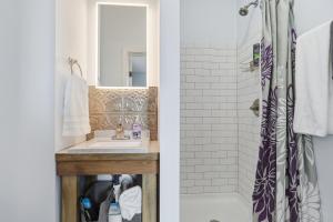 a bathroom with a sink and a shower at The Tiptonian in Tipton