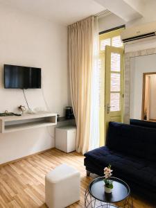 a living room with a couch and a table at Vernisa Hotel in Tbilisi City