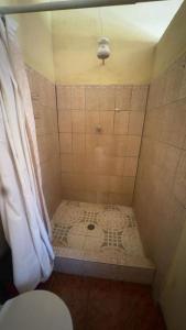 a bathroom with a shower with a toilet in it at Accommodation in Copán Ruinas #7 in Copán Ruinas +6 photos