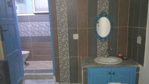 a bathroom with a sink and a toilet at dar fatma matmata in Matmata