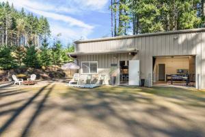 a house with a patio and a yard at Peaks View Bunk House in Hillsboro