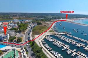 an aerial view of a marina with boats at La Casa sulla Spiaggia Torre San Giovanni - Coste del Sud it in Torre San Giovanni Ugento