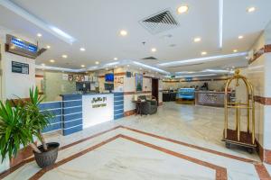 a lobby of a hospital with a waiting room at Al Ayniah Hotel in Medina
