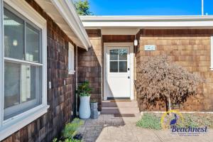 a house with a white door and a window at Tiki Tides in Rio Del Mar +45 photos