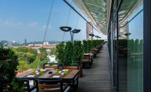 a row of tables on the roof of a building at Hilton Belgrade in Belgrade