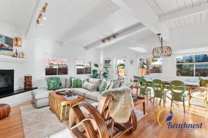 a living room with a couch and a table at Tiki Tides in Rio Del Mar