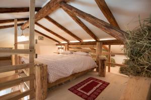 A bed or beds in a room at Maso Del Fieno con Sauna Privata e Vista Unica