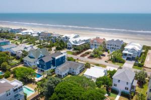 an aerial view of a beach with houses and the ocean at Beach Bungalow Upper Unit Steps To Shore in Isle of Palms