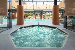 a hot tub in the middle of a building at DoubleTree by Hilton Islantilla Beach Golf Resort in Islantilla