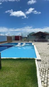 a large swimming pool on top of a building at Casa Condomínio Reserva do Delta in Parnaíba
