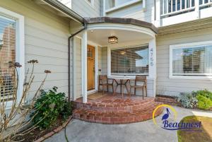 a front porch of a house with a table at Opal Cliff Overlook in Santa Cruz