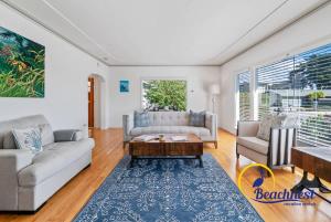 a living room with two couches and a coffee table at Opal Cliff Overlook in Santa Cruz