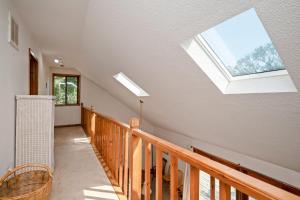 a house with a skylight on the ceiling at The Rectory by Oak Island Accommodations in Oak Island +42 photos