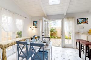 a kitchen and dining room with a table and chairs at Relaxation Station in Corona del Mar