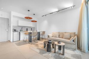 a living room with a couch and a kitchen at Redsearent front Pool and mountain View in Eilat