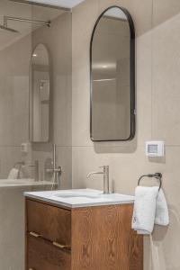 a bathroom with a sink and a mirror at Redsearent front Pool and mountain View in Eilat +10 photos