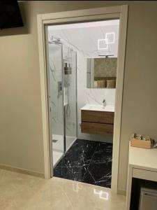 a bathroom with a shower and a sink at Aurea Boutique Rooms in Termoli