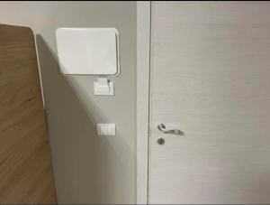 a white door with a window on the side of it at Aurea Boutique Rooms in Termoli