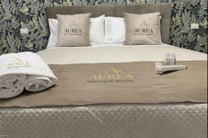 a bed with aricaoudrophiclords sign on it at Aurea Boutique Rooms in Termoli +4 photos